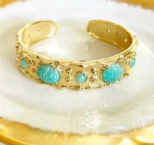 Designer style cuff bracelet with faux turquoise stone accents